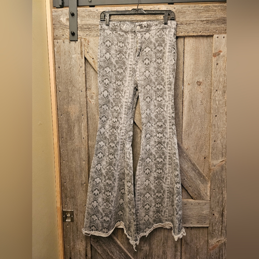 Free People Snake Print Just Float On Flare Jeans size 29-30.